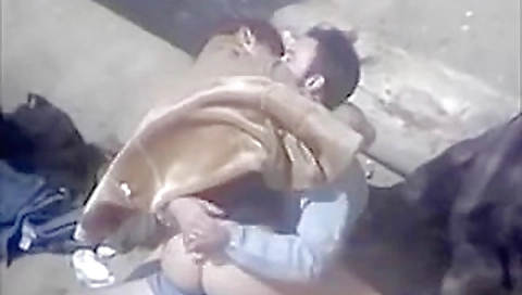 amateur couple having sex on the beach